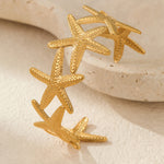 Load image into Gallery viewer, Twin Tides Interlocked Shell Bangle
