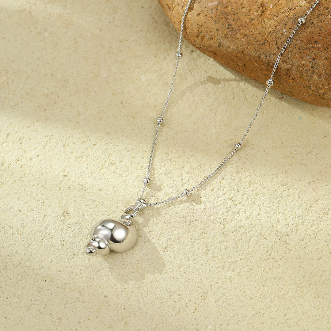 Sonic Spiral: Bimetallic Conch Necklace
